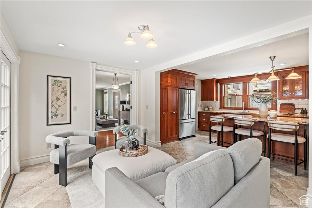 Living area with recessed lighting and baseboards