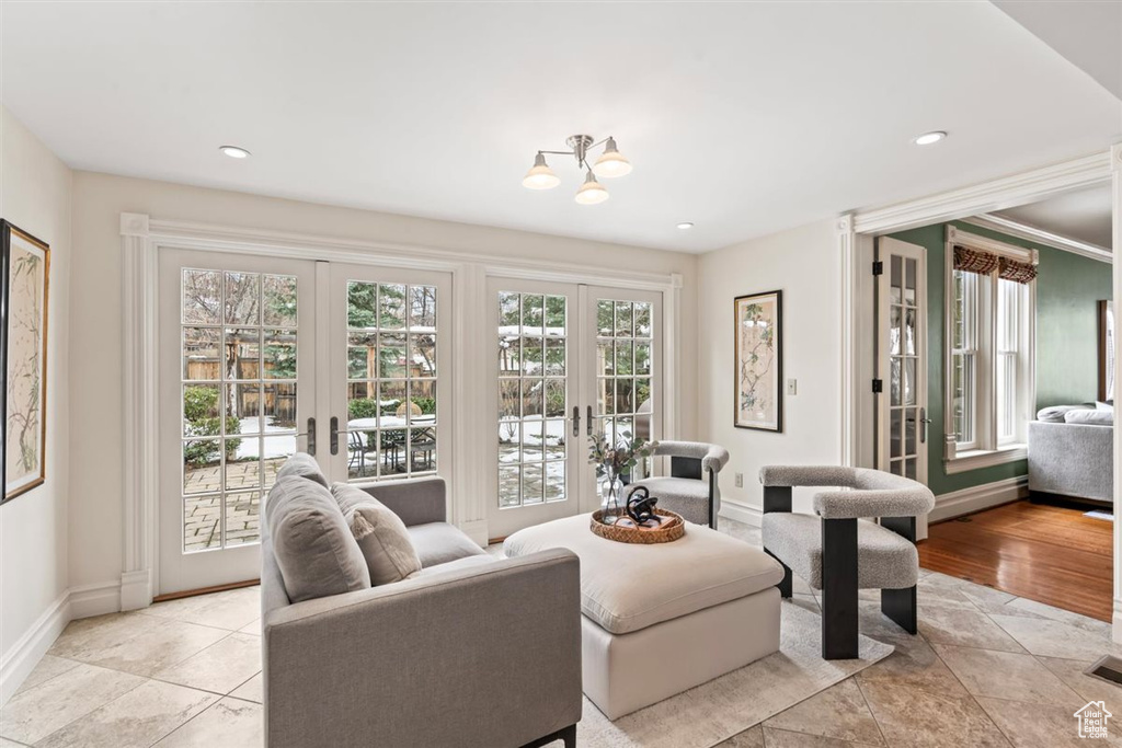 Living area featuring visible vents, recessed lighting, french doors, and baseboards