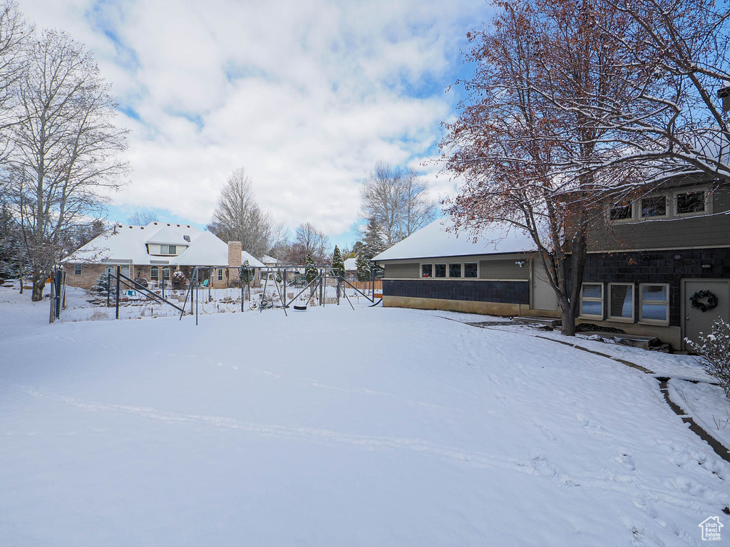 View of yard layered in snow