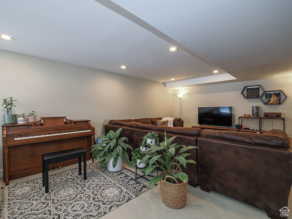Living area featuring recessed lighting and light colored carpet