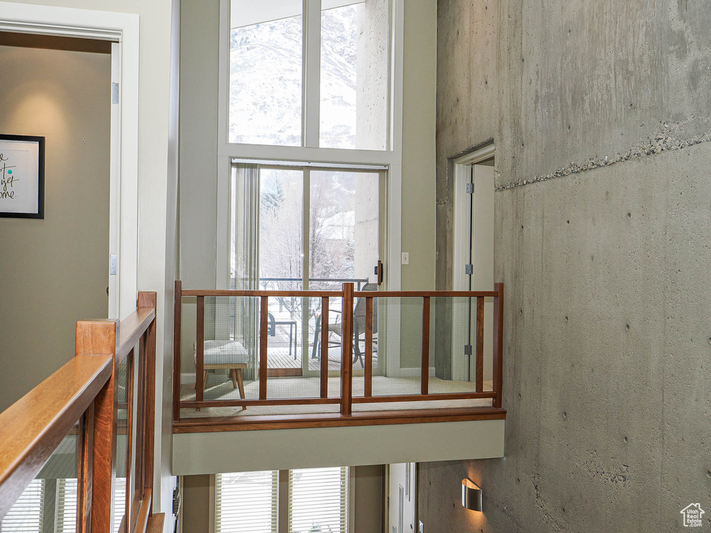 Staircase featuring a high ceiling