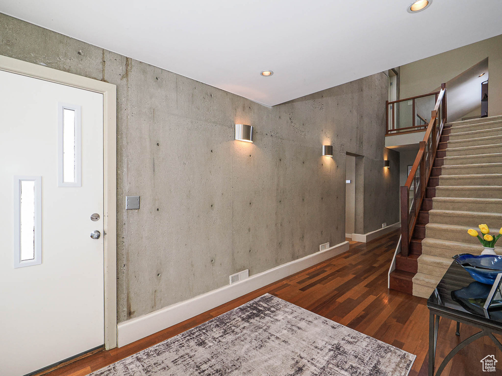 Interior space with visible vents, baseboards, stairs, recessed lighting, and wood finished floors