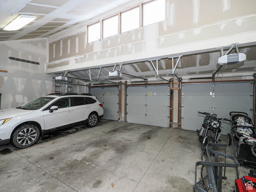 Garage featuring a garage door opener