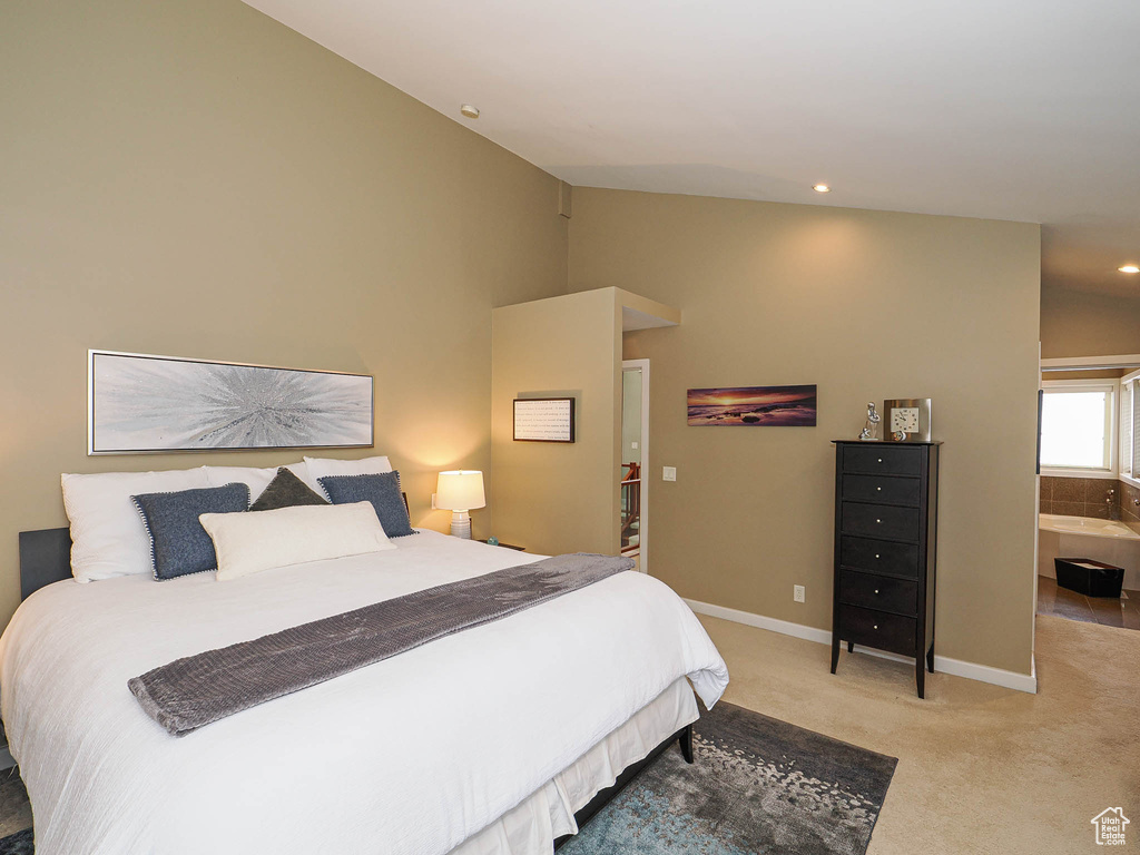 Bedroom with recessed lighting, light colored carpet, lofted ceiling, and baseboards