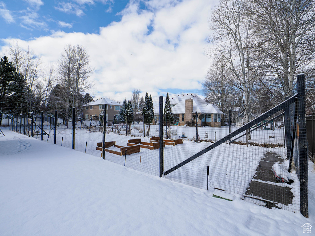 Snowy yard with fence