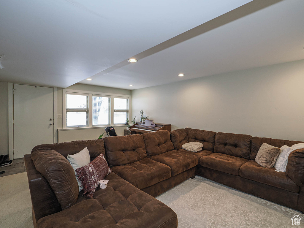 Living room featuring recessed lighting and light carpet