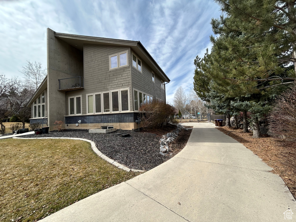 View of home\\\'s exterior with a yard