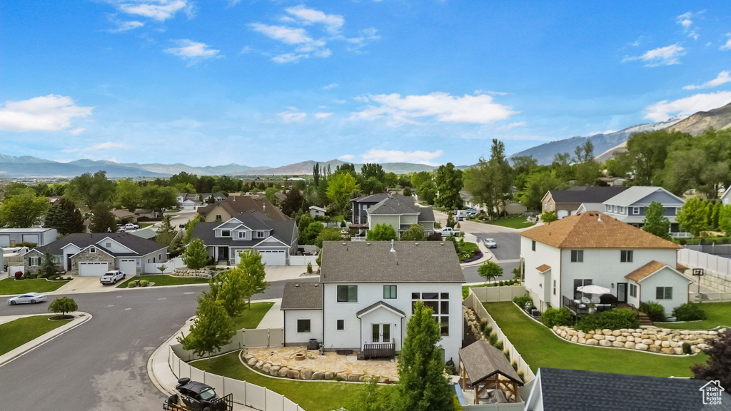 Aerial perspective of suburban area with a mountainous background