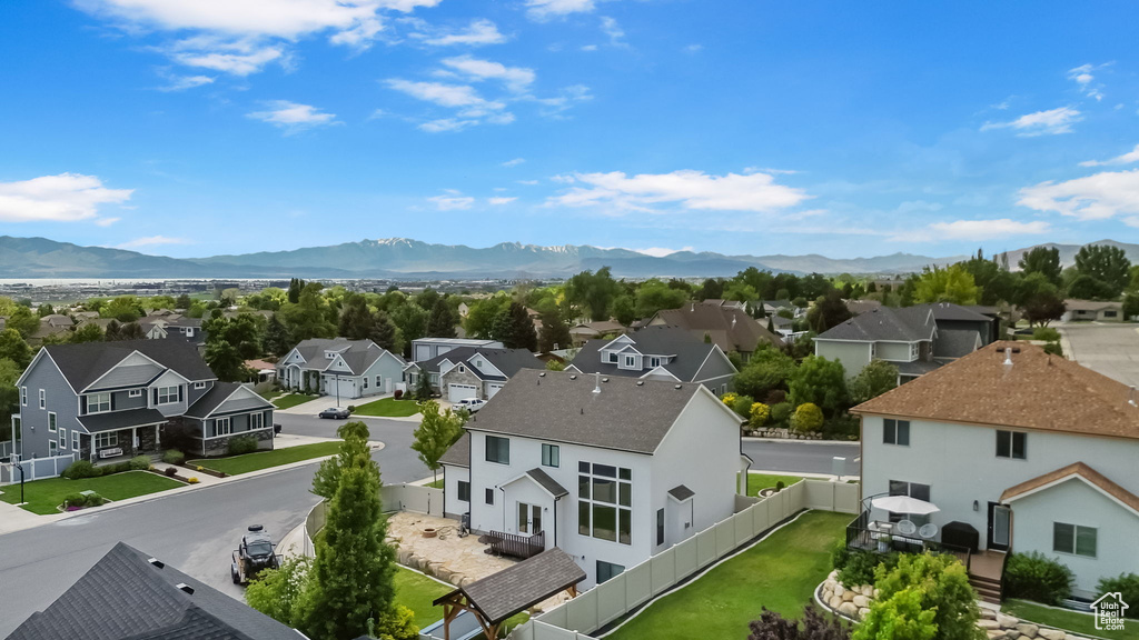 Aerial perspective of suburban area featuring a mountain backdrop
