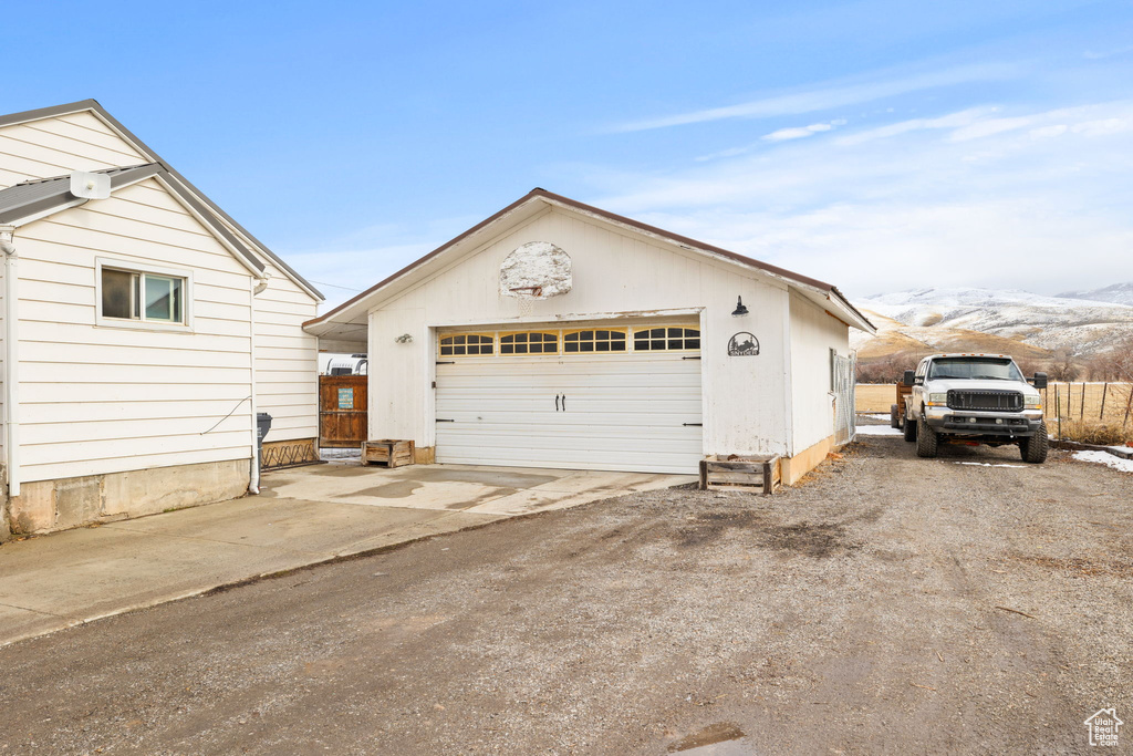 Detached garage with a mountain view