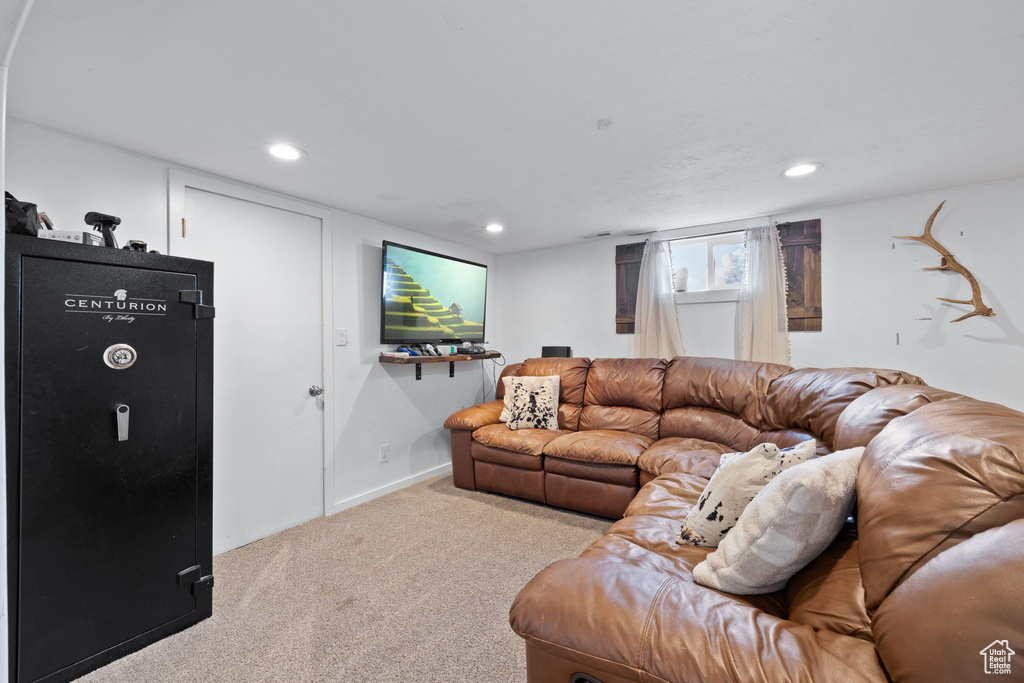 Living area featuring recessed lighting, baseboards, and carpet flooring