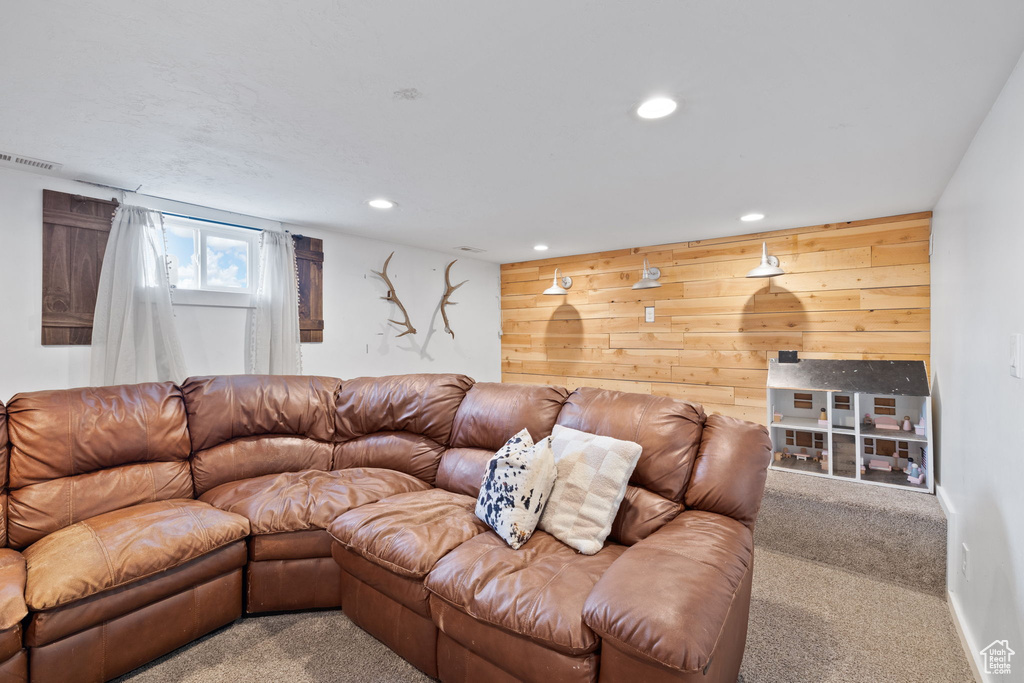 Living area with recessed lighting, visible vents, baseboards, and carpet flooring
