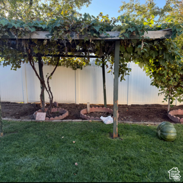 View of yard featuring fence