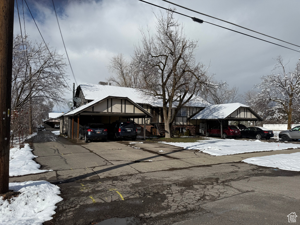 View of front of home featuring a carport and driveway