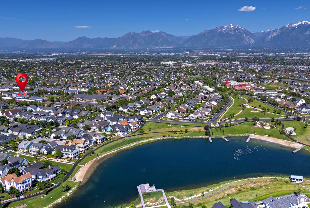 View of property location with a water and mountain view and nearby suburban area