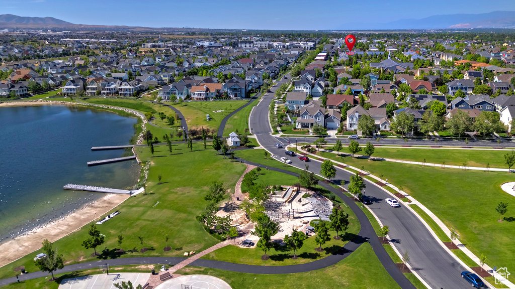 Aerial overview of property\'s location featuring a water and mountain view and nearby suburban area