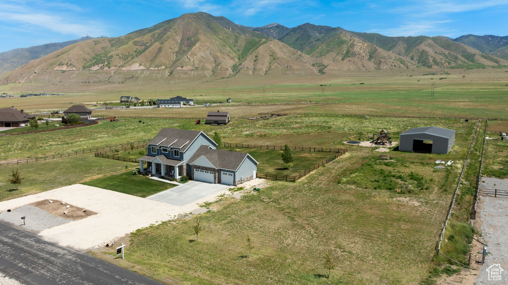 View of mountain backdrop featuring rural landscape and agricultural land