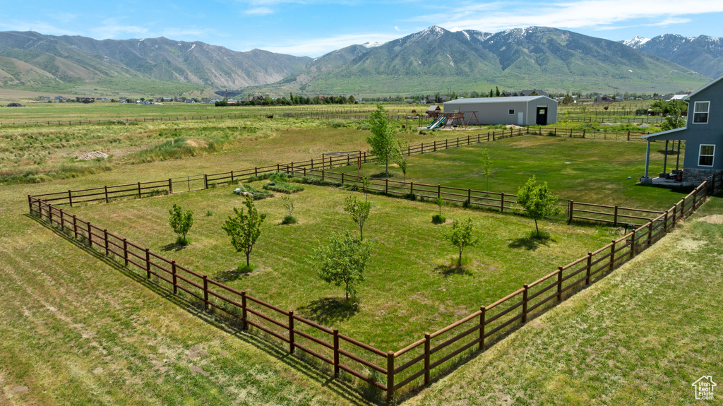 View of mountain backdrop featuring rural landscape and a pastoral area
