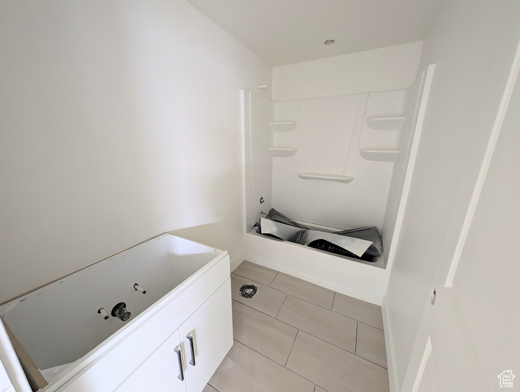 Full bath featuring tile patterned floors
