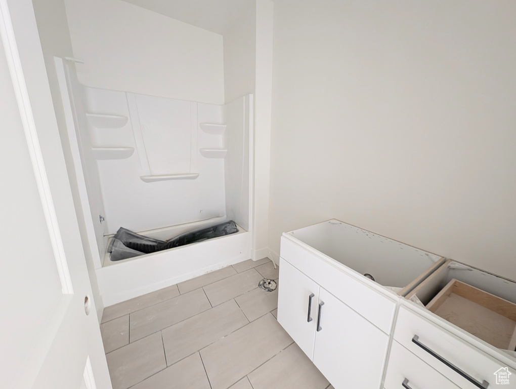 Full bath featuring tile patterned flooring