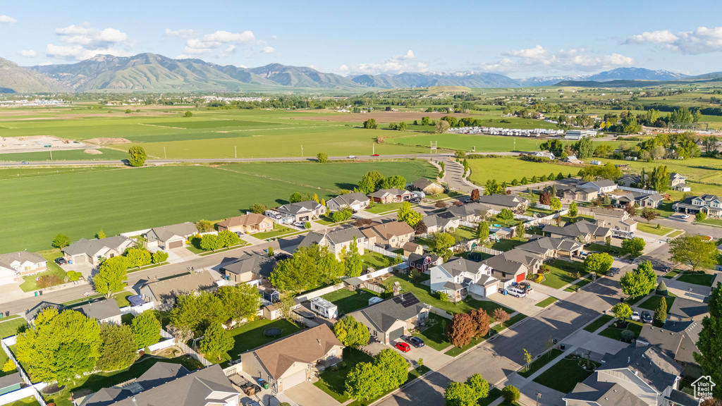 Aerial perspective of suburban area with a mountain backdrop