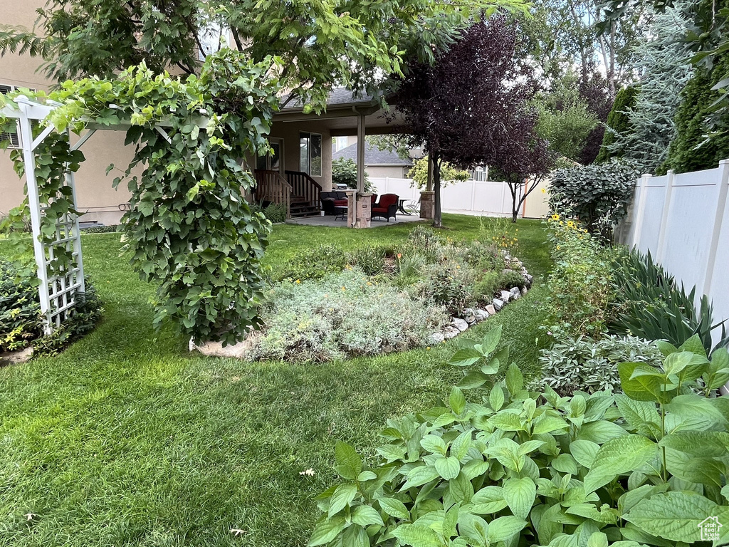 View of yard with a patio area and a fenced backyard