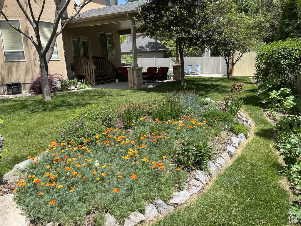 View of yard featuring a patio area and fence