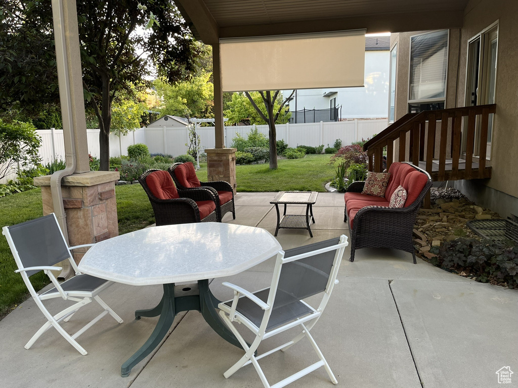 View of patio / terrace featuring a fenced backyard, outdoor lounge area, and outdoor dining area