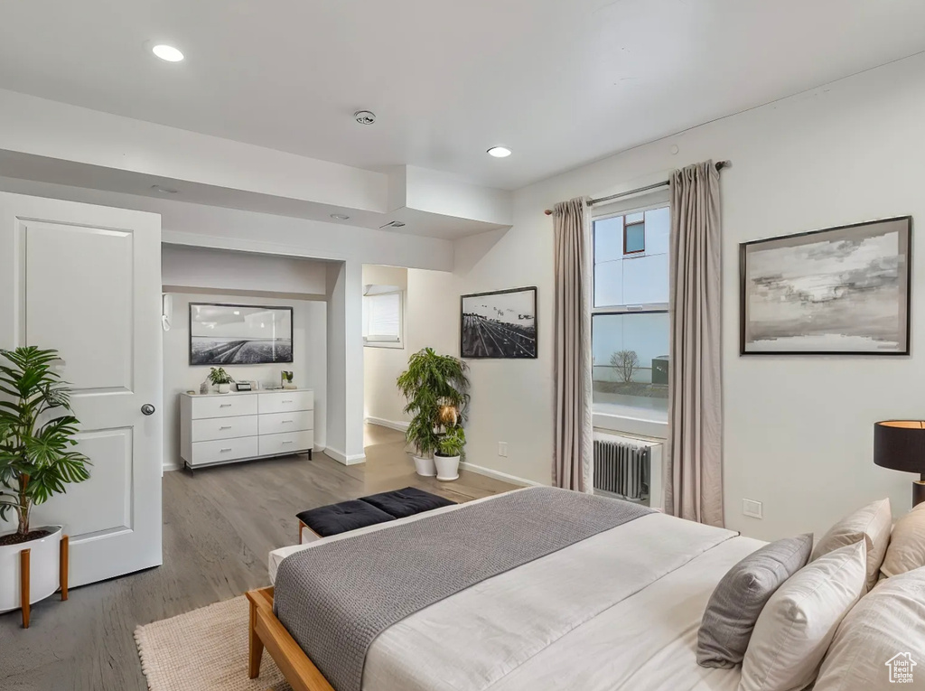 Bedroom featuring recessed lighting, baseboards, and wood finished floors
