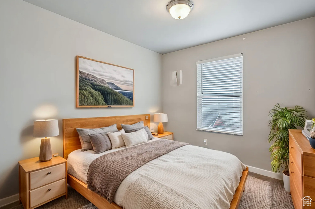 Carpeted bedroom with baseboards