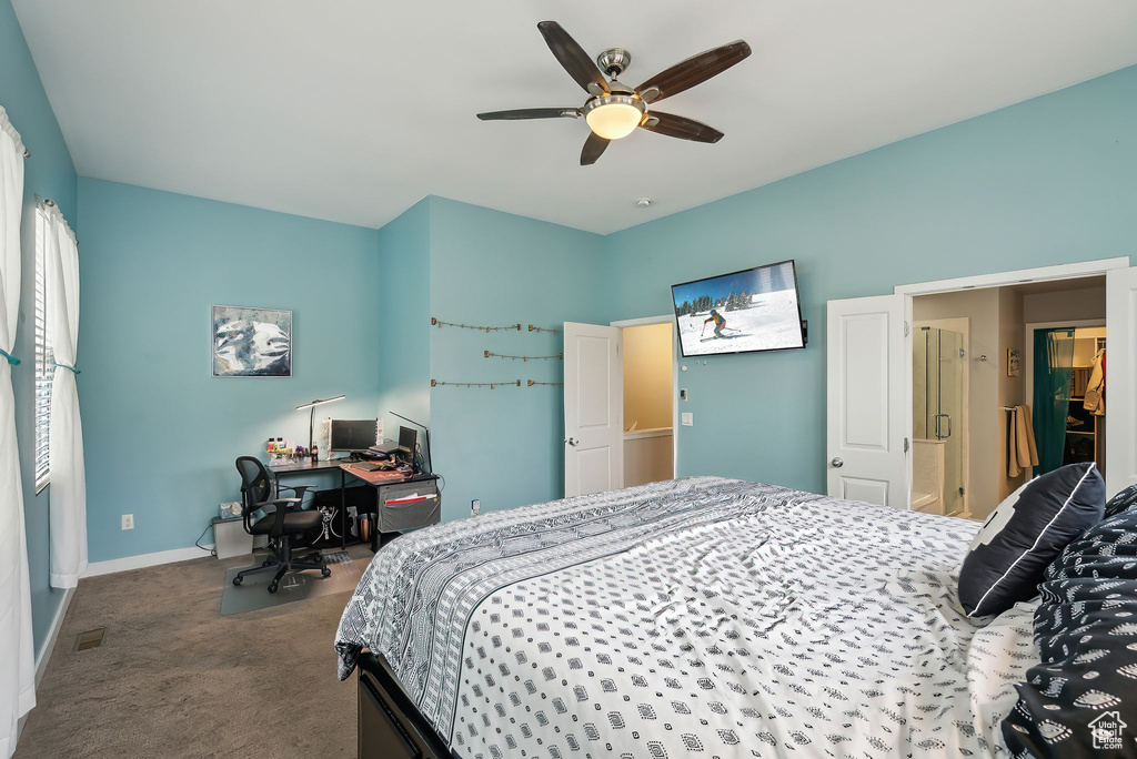 Carpeted bedroom with baseboards and a ceiling fan