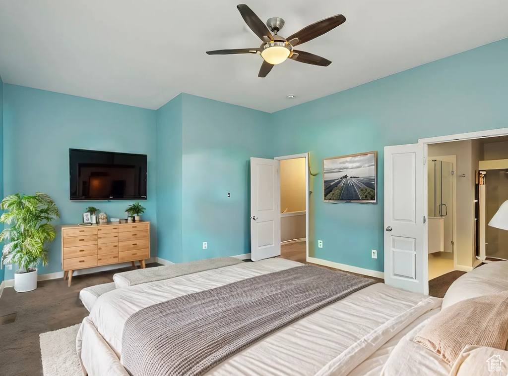 Carpeted bedroom featuring baseboards and a ceiling fan