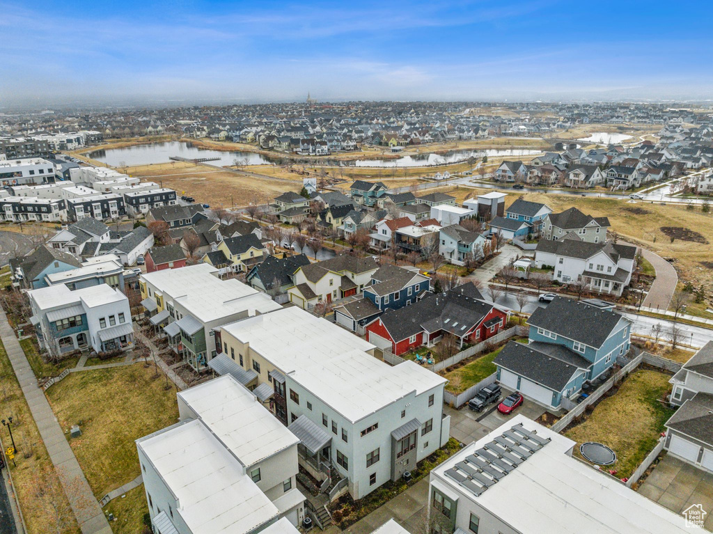 Bird\'s eye view with a residential view and a water view