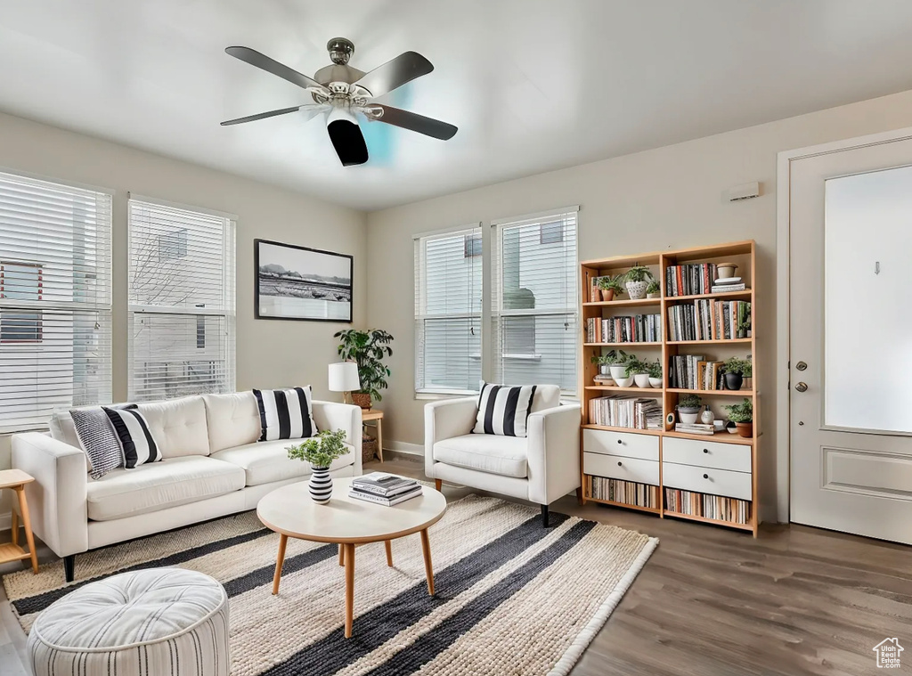 Living room featuring a ceiling fan and wood finished floors