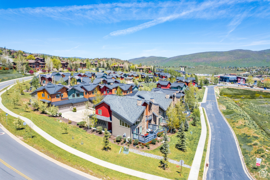 Aerial view of residential area featuring a mountain backdrop