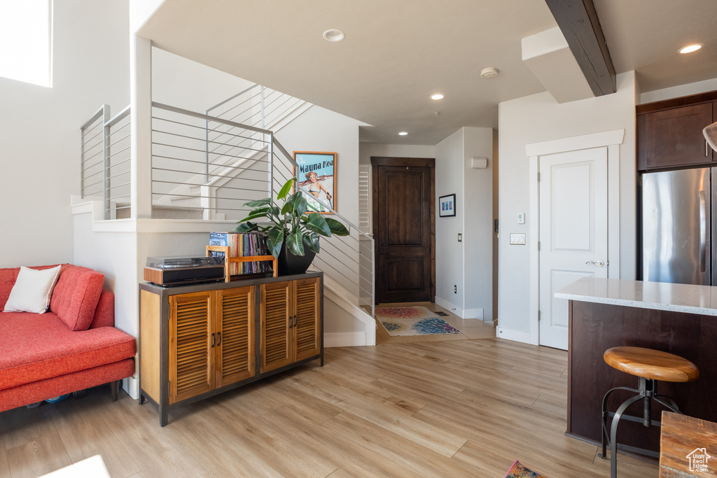 Entrance foyer featuring light wood-style flooring, recessed lighting, and baseboards