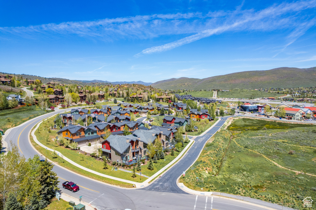 Aerial perspective of suburban area with a mountain backdrop