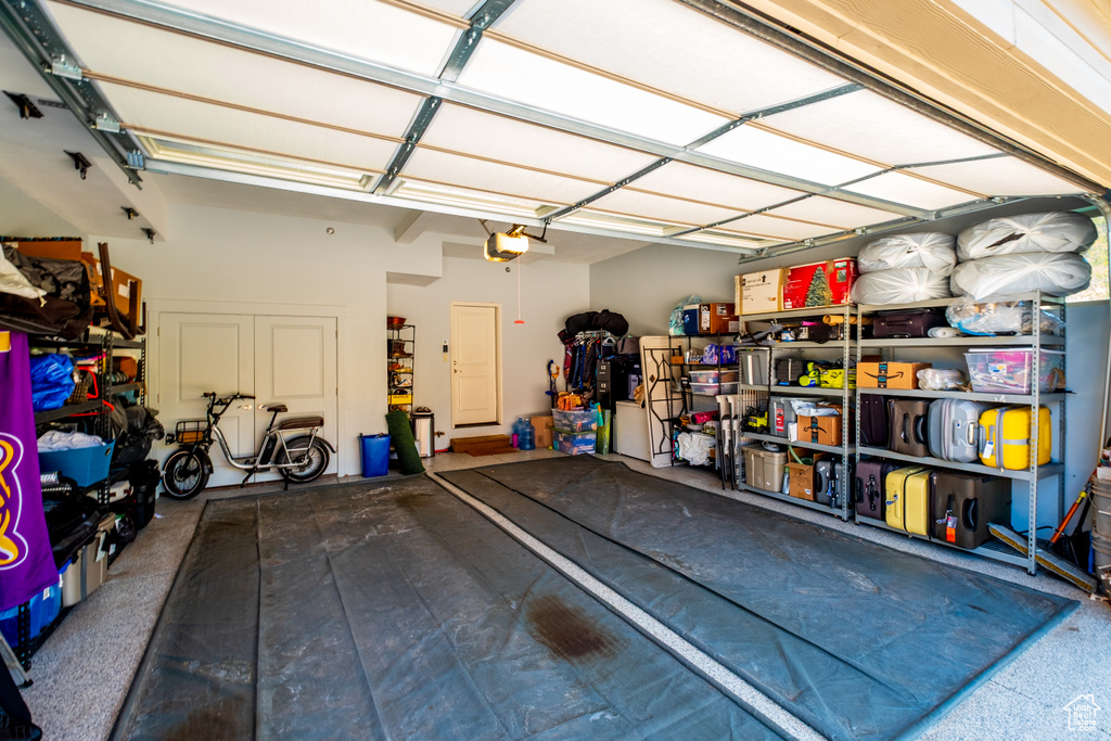 Garage featuring a garage door opener
