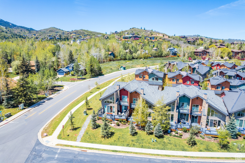 Aerial view of residential area featuring mountains