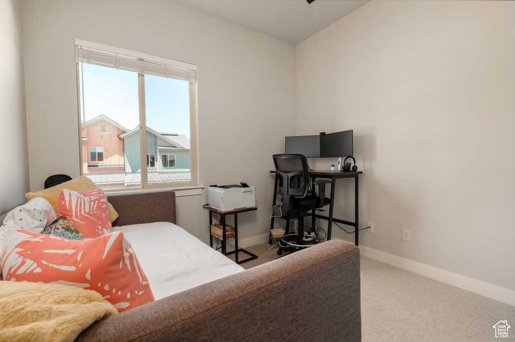 Carpeted bedroom with baseboards