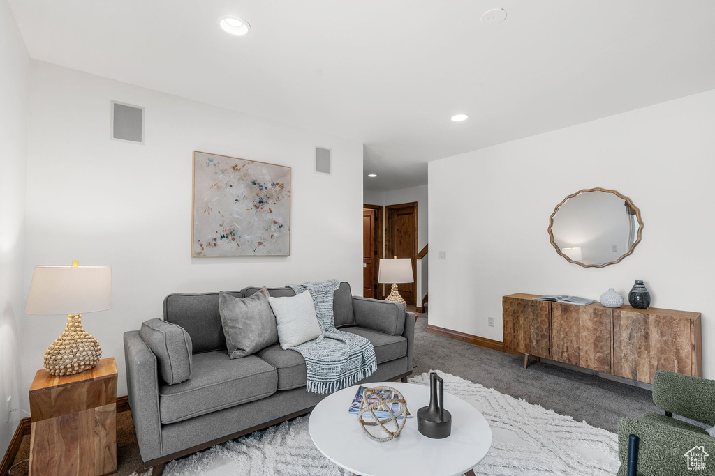Living room with carpet flooring and recessed lighting