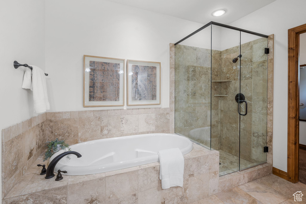Full bath with a garden tub and a shower stall