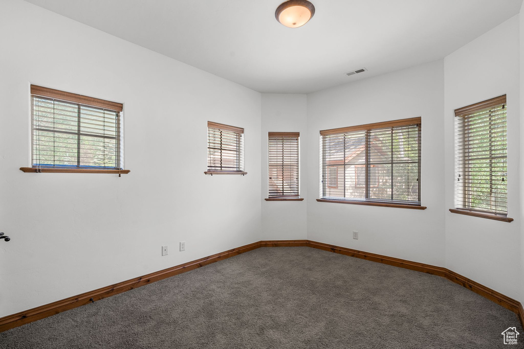 Spare room featuring carpet floors
