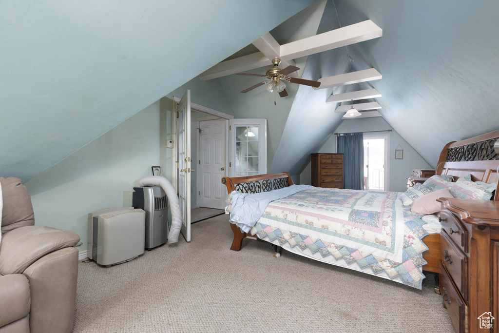 Carpeted bedroom with vaulted ceiling with beams and ceiling fan