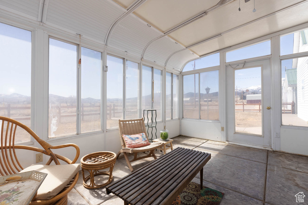 Sunroom with a mountain view