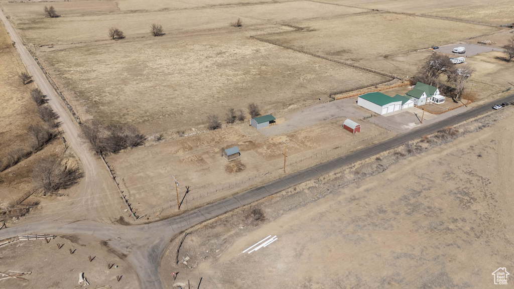 Birds eye view of property featuring a rural view