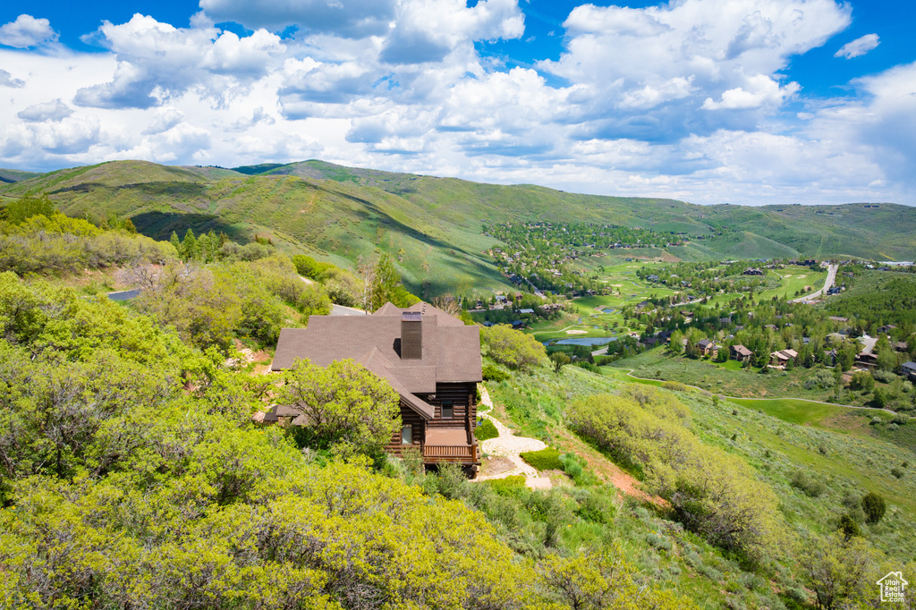 View of subject property featuring a mountainous background