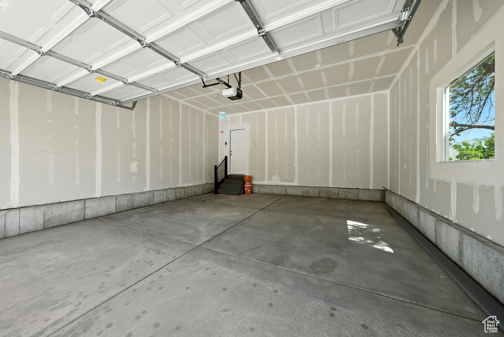 Garage featuring a garage door opener