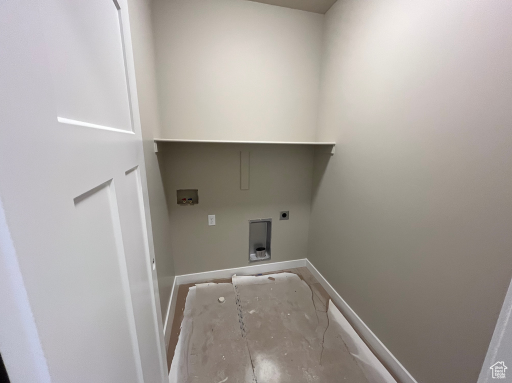 Washroom featuring baseboards, hookup for a washing machine, and electric dryer hookup