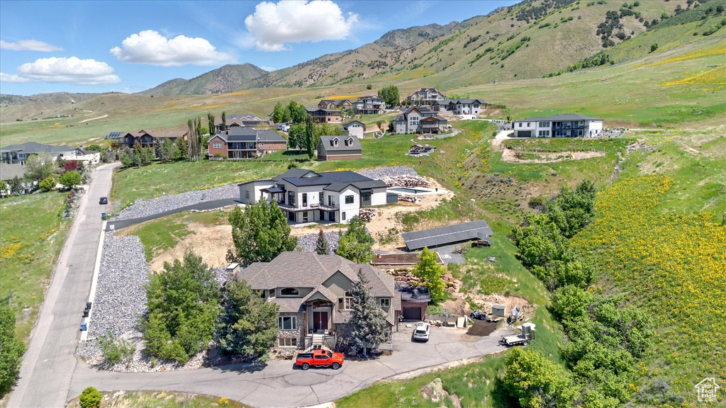 Aerial view of residential area featuring mountains